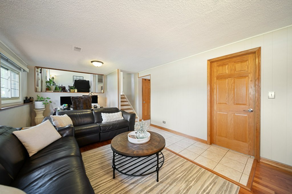 365 West Myrick Avenue Addison, IL 60101 - Photo 15 of 49 a living room with furniture and a wooden floor