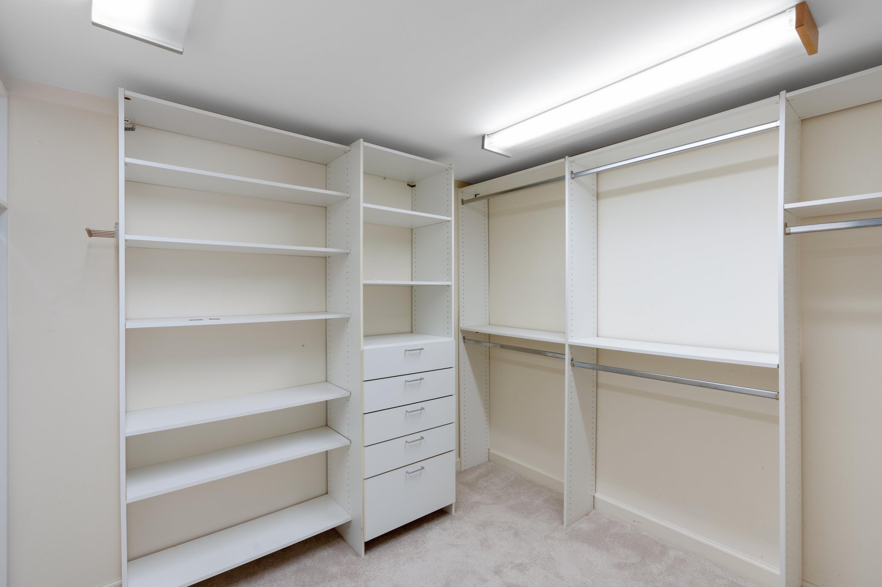 529 South Flagler Drive, Unit 6E West Palm Beach, FL 33401 - Photo 16 of 24 a view of walk in closet with empty racks