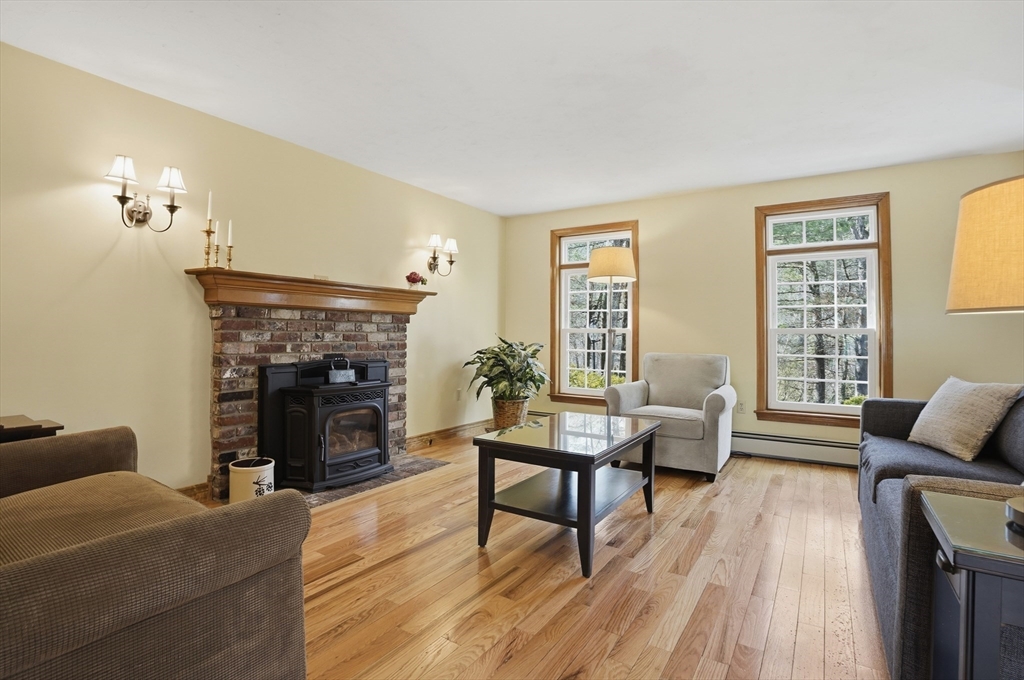4 Charnock Circle Rutland, MA 01543 - Photo 13 of 42 a living room with furniture and a fireplace