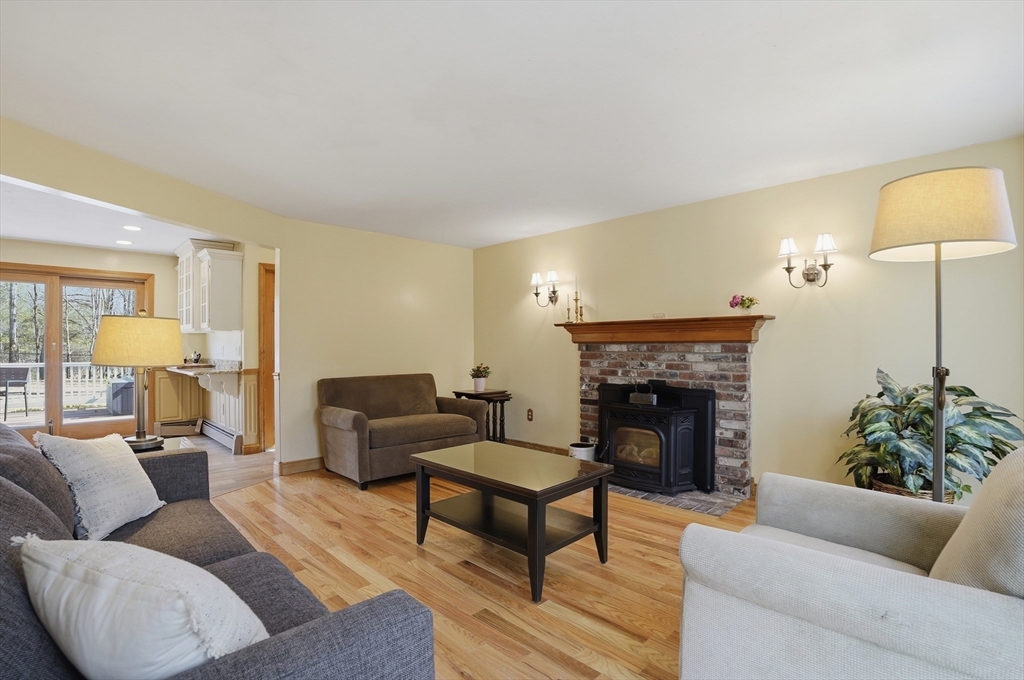 4 Charnock Circle Rutland, MA 01543 - Photo 14 of 42 a living room with furniture and a fireplace