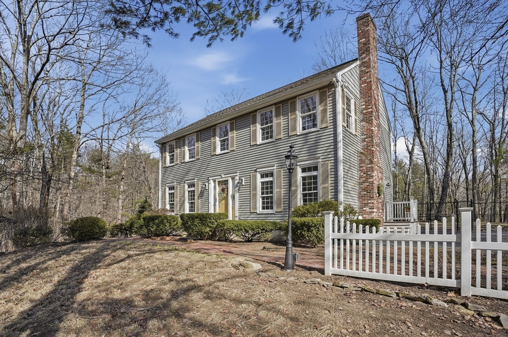 4 Charnock Circle Rutland, MA 01543 - Photo 3 of 42 a front view of a house with garden