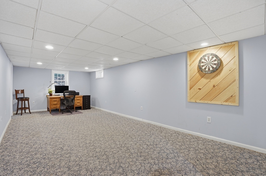 4 Charnock Circle Rutland, MA 01543 - Photo 34 of 42 a room with furniture and a large window