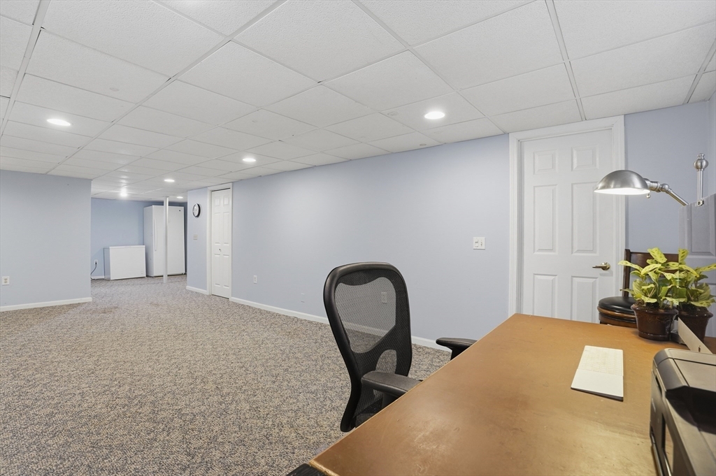 4 Charnock Circle Rutland, MA 01543 - Photo 35 of 42 a bedroom with a bed and a chair