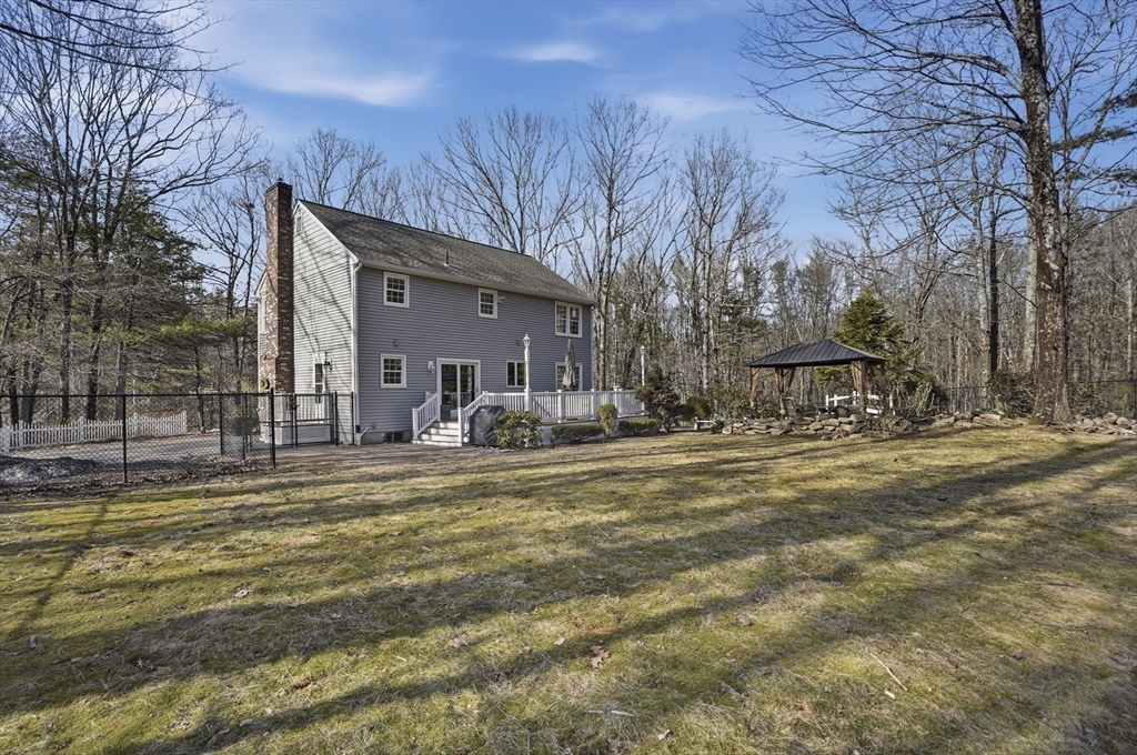 4 Charnock Circle Rutland, MA 01543 - Photo 40 of 42 a front view of a house with a yard
