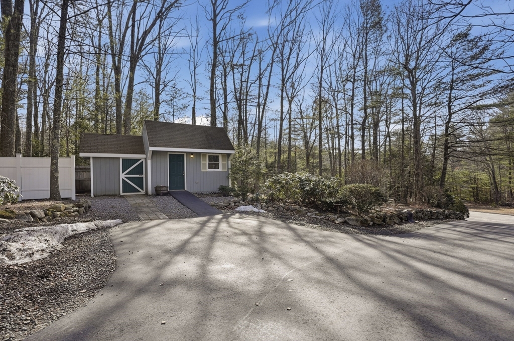 4 Charnock Circle Rutland, MA 01543 - Photo 41 of 42 a view of a house with a yard covered with snow and trees