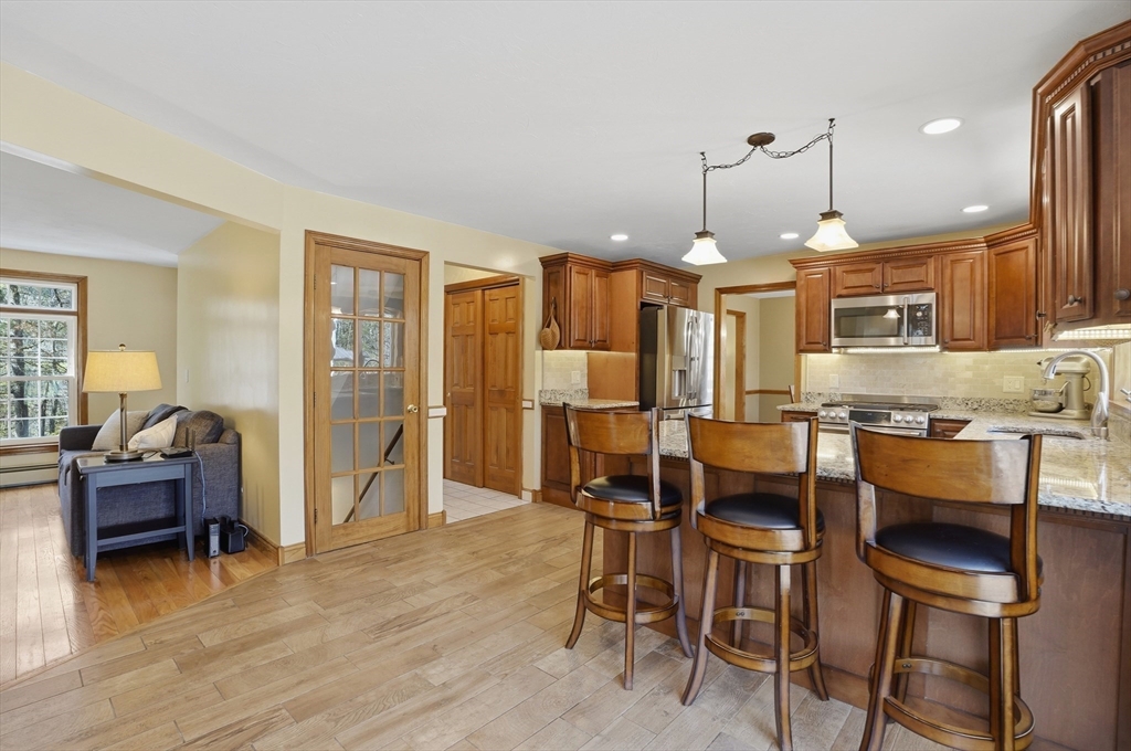 4 Charnock Circle Rutland, MA 01543 - Photo 6 of 42 a large kitchen with a table and chairs