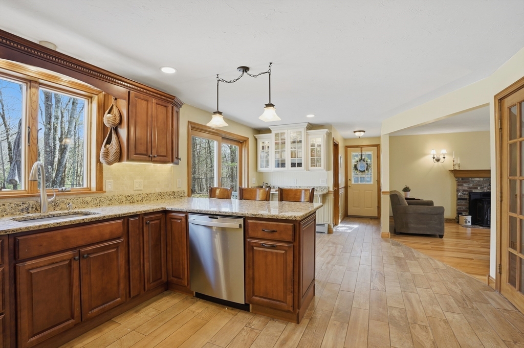 4 Charnock Circle Rutland, MA 01543 - Photo 10 of 42 a large kitchen with lots of counter space sink and dining table