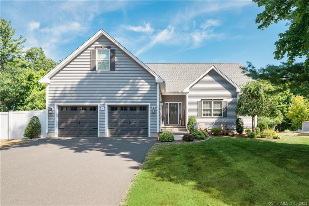 58 Evergreen Road Cromwell, CT 06416 - Photo 1 of 1 a front view of a house with a yard and trees