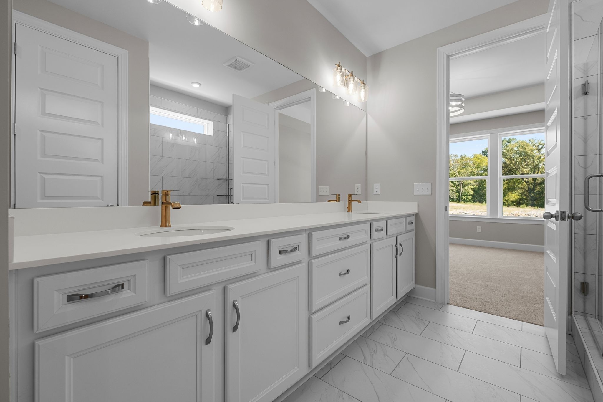 2001 Tee Time Trace Mount Juliet, TN 37122 - Photo 17 of 34 a bathroom with a double vanity sink a mirror and a shower