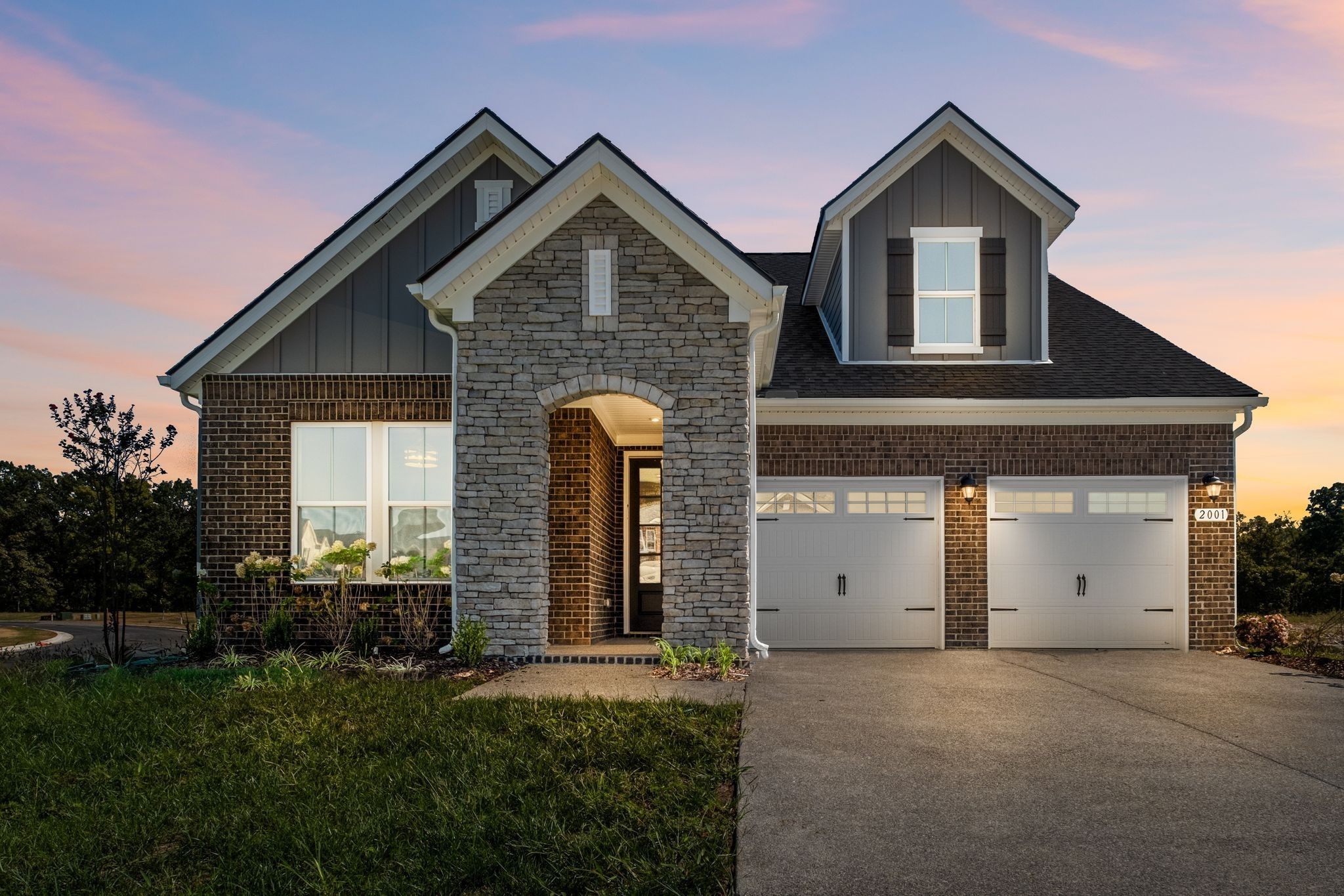 2001 Tee Time Trace Mount Juliet, TN 37122 - Photo 2 of 34 a front view of a house with a yard and garage