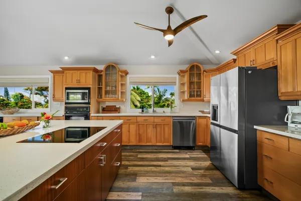 a kitchen with a refrigerator and a sink