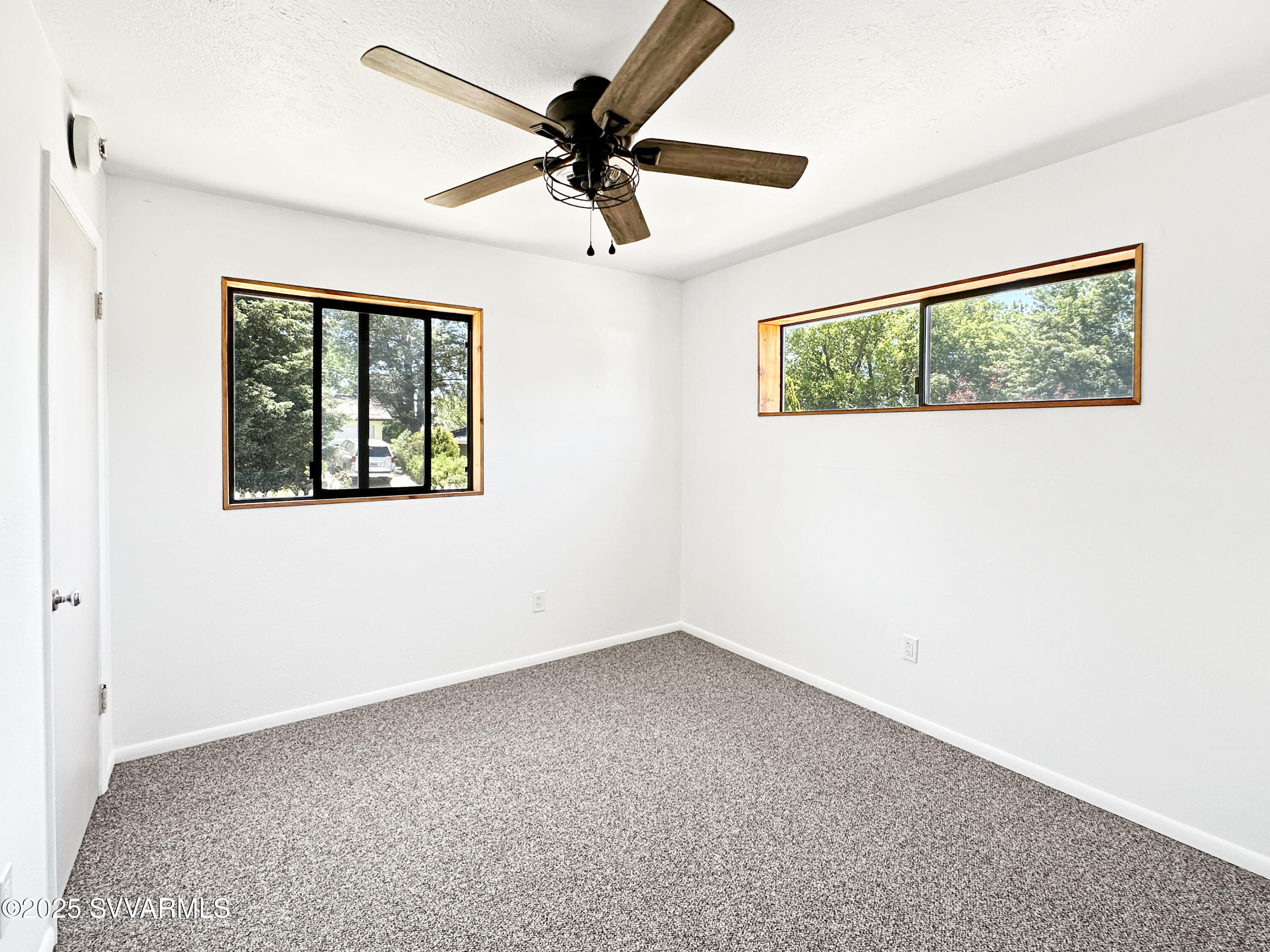 3219 North Manor Road Flagstaff, AZ 86004 - Photo 13 of 23 an empty room with a window