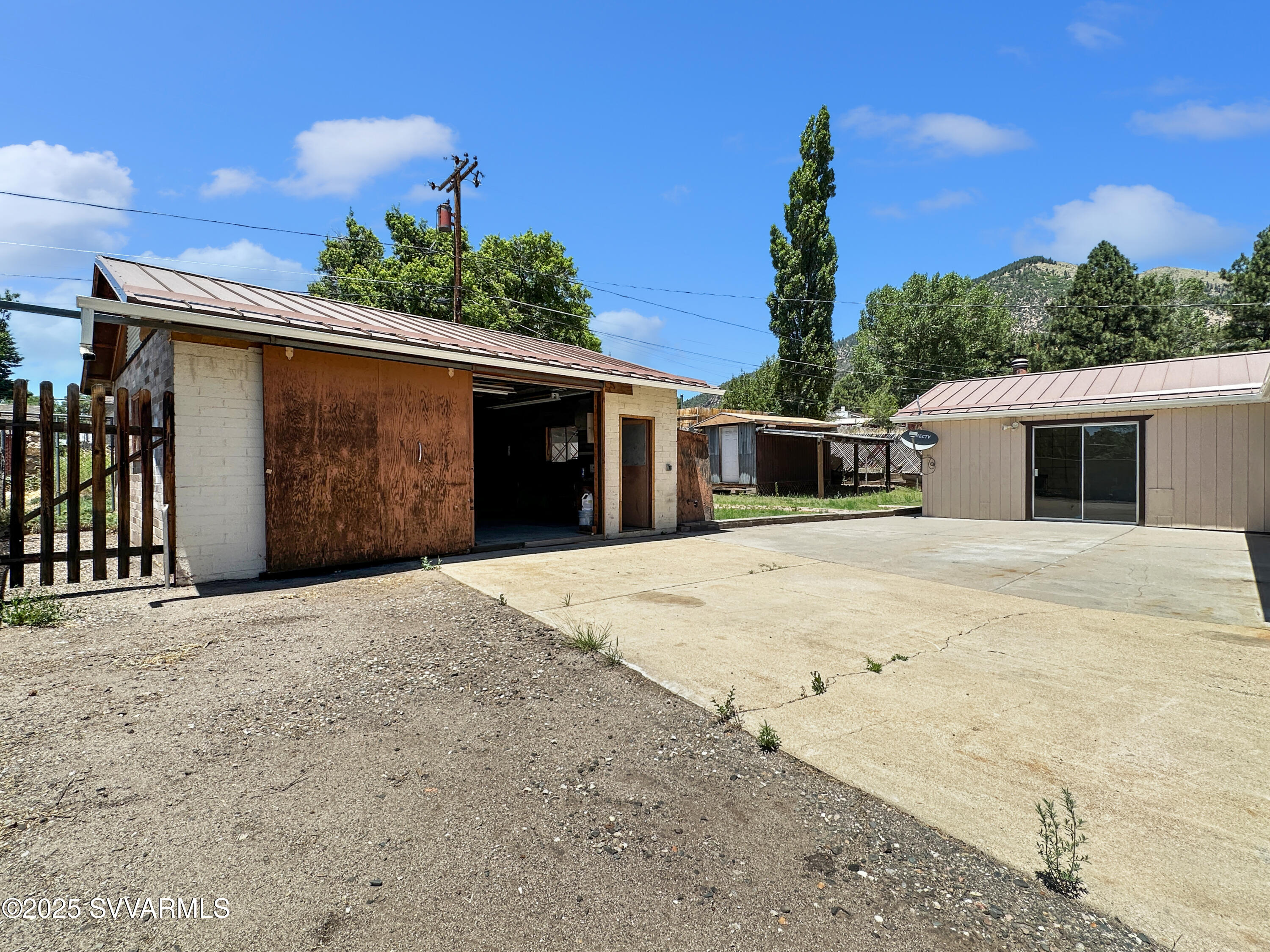3219 North Manor Road Flagstaff, AZ 86004 - Photo 18 of 23 a front view of a house with a yard and garage