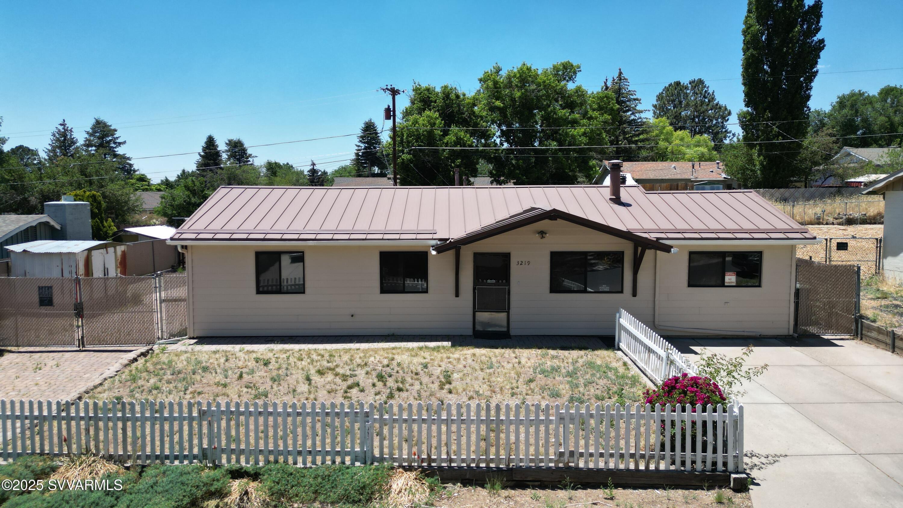 3219 North Manor Road Flagstaff, AZ 86004 - Photo 23 of 23 a front view of a house with a yard