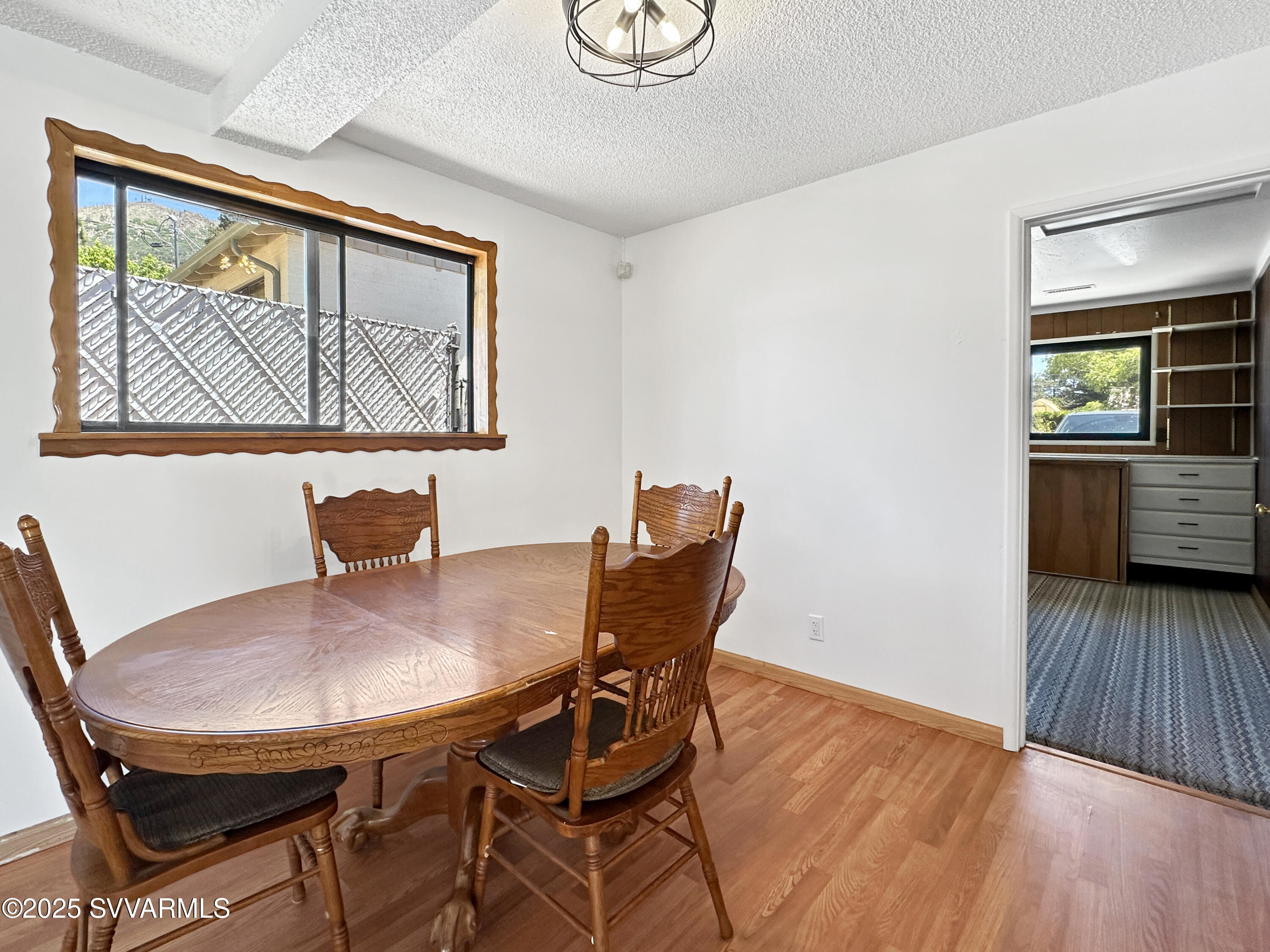 3219 North Manor Road Flagstaff, AZ 86004 - Photo 8 of 23 a view of a dining room with furniture and wooden floor