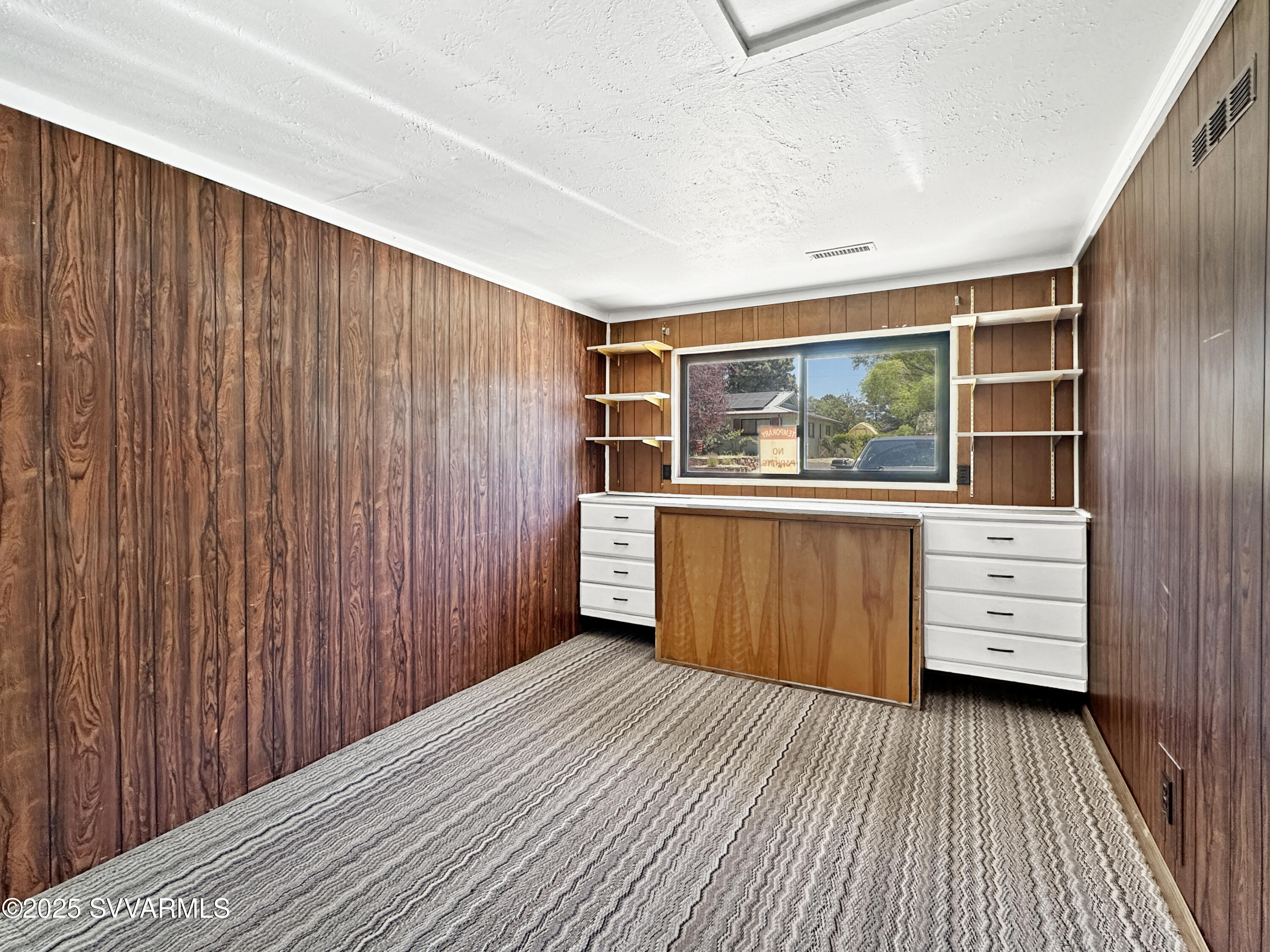 3219 North Manor Road Flagstaff, AZ 86004 - Photo 9 of 23 a view of a room with wooden floor and windows