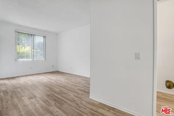 a view of a room that has a window in it