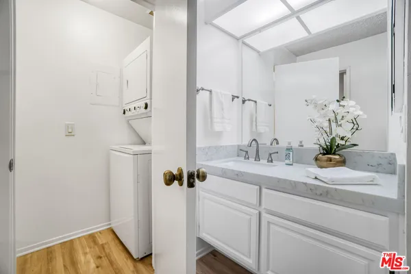 a bathroom with a sink and mirror