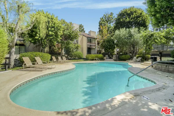 a view of a swimming pool with a sitting space