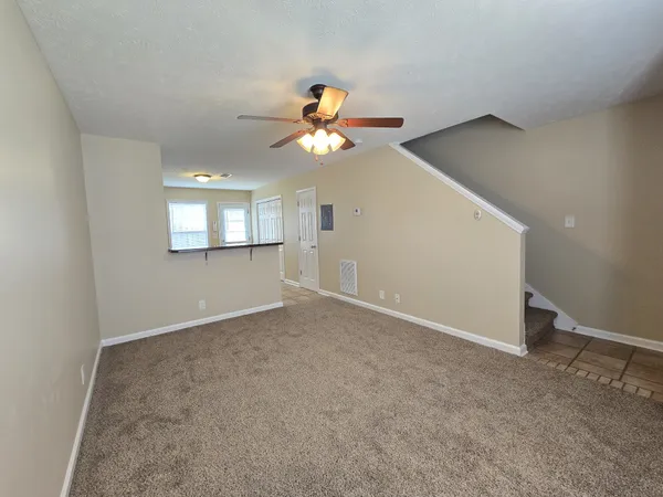 a view of an empty room and window