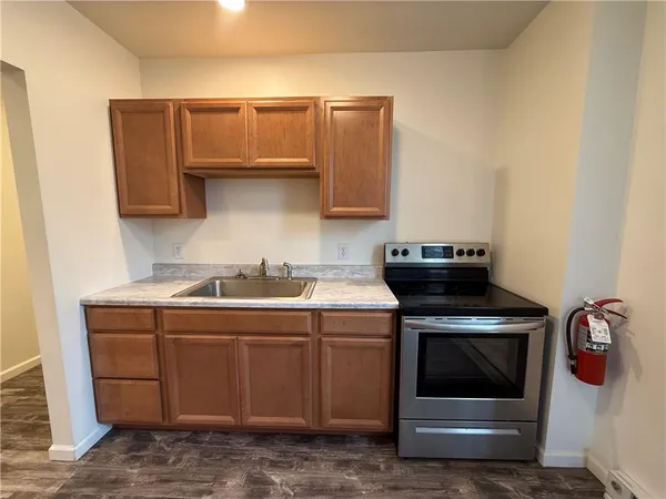 a kitchen with a stove and a sink