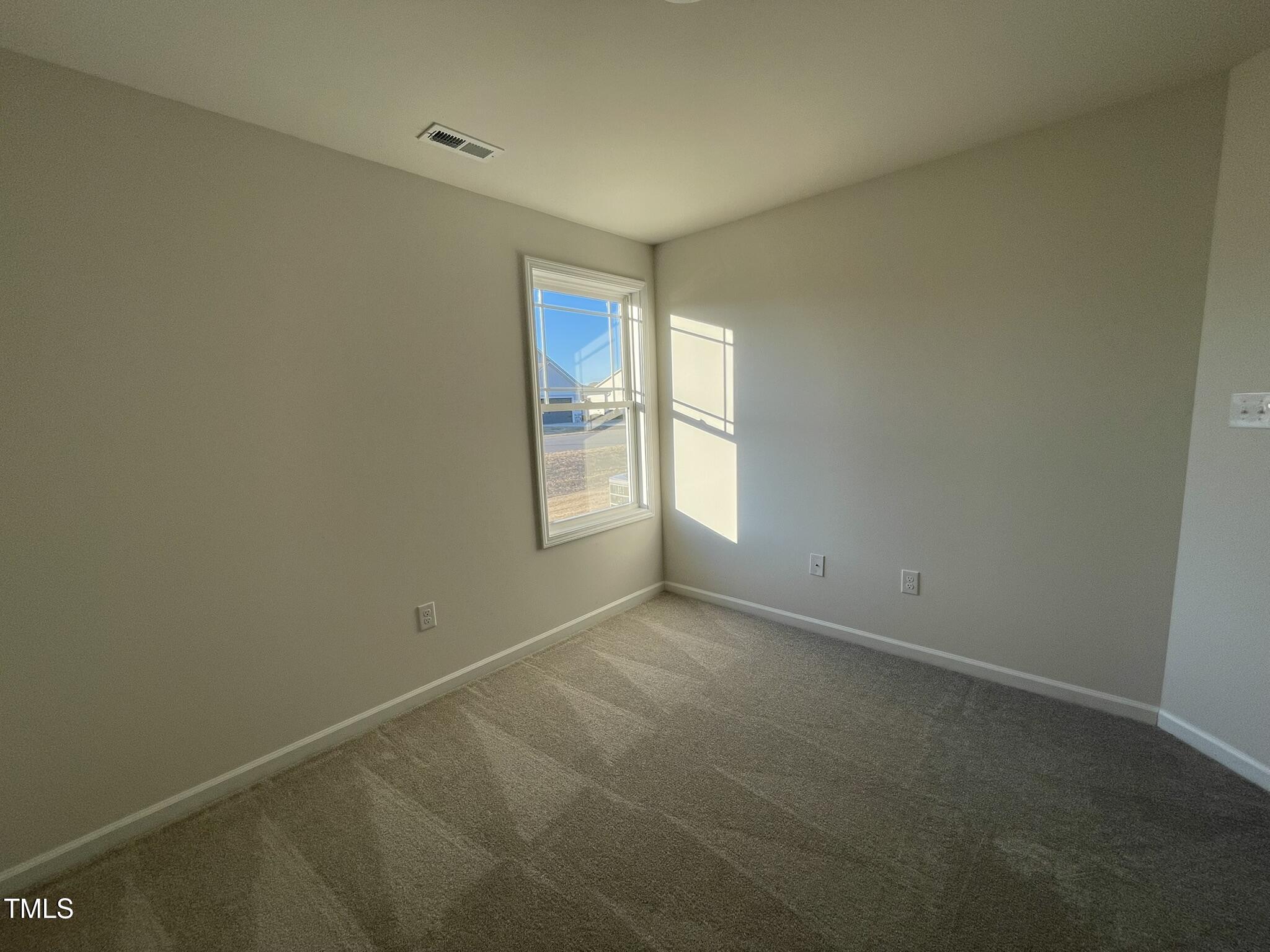 12 Flatland Drive Princeton, NC 27569 - Photo 11 of 20 an empty room with windows