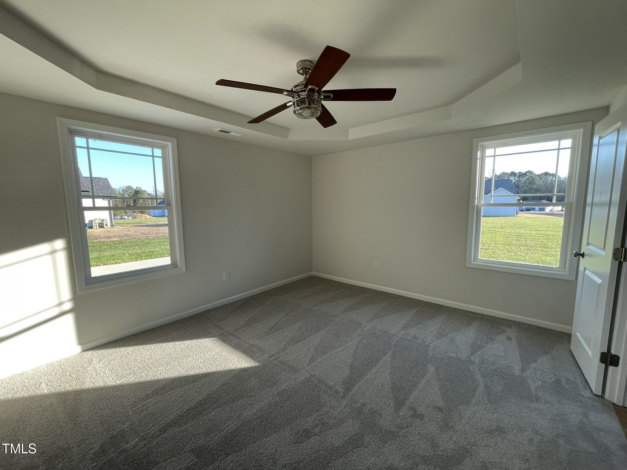 12 Flatland Drive Princeton, NC 27569 - Photo 15 of 20 a view of empty room with window and ceiling fan