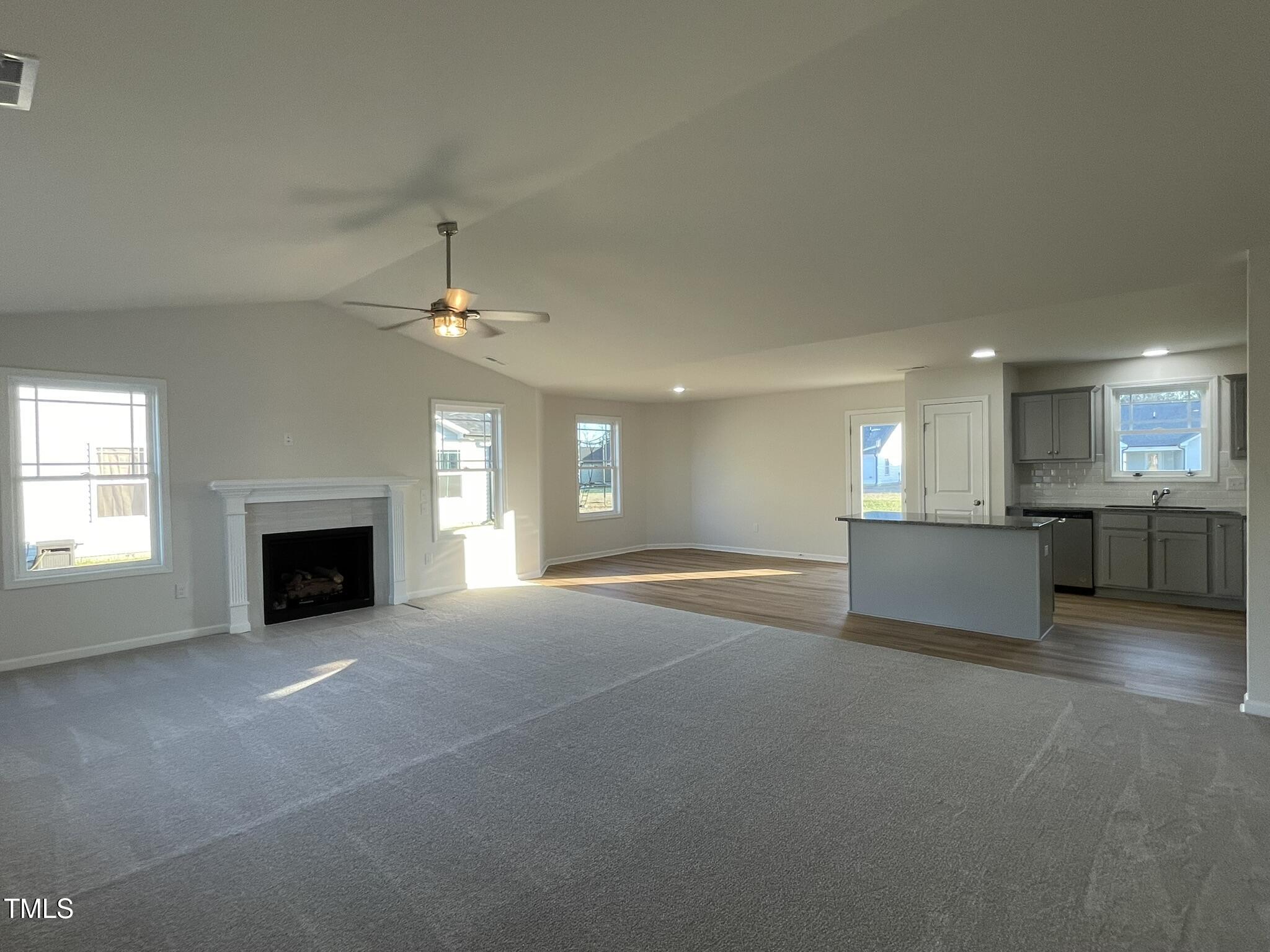 12 Flatland Drive Princeton, NC 27569 - Photo 2 of 20 a view of an empty room with a fireplace and window