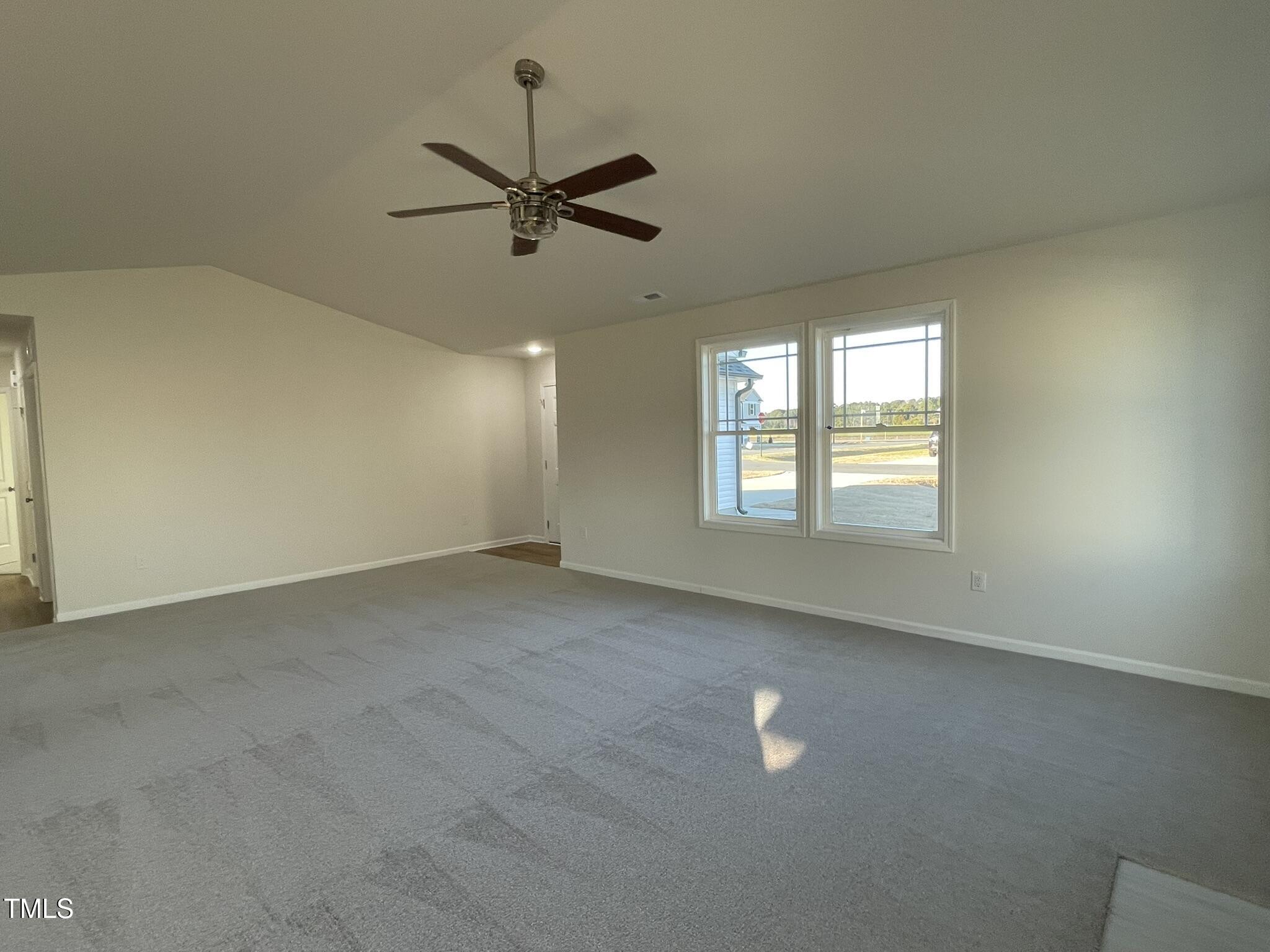 12 Flatland Drive Princeton, NC 27569 - Photo 6 of 20 a view of an empty room with a window
