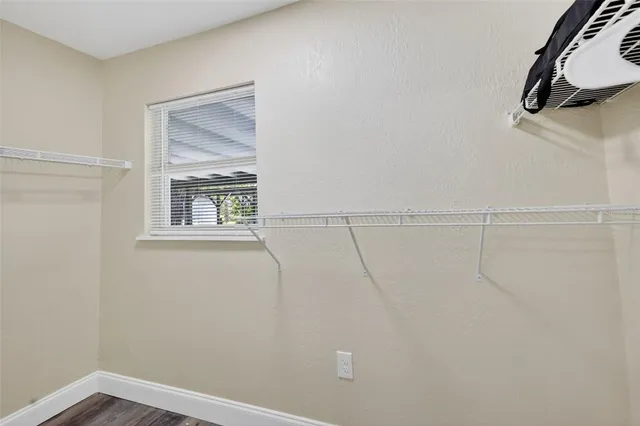 a view of small space with empty racks on the wall