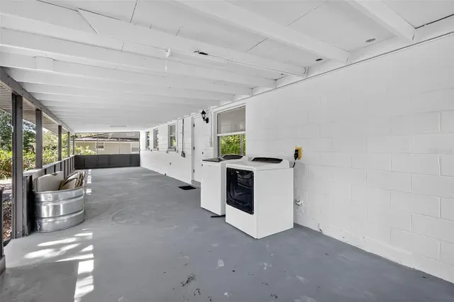 a view of a livingroom with furniture and a fireplace