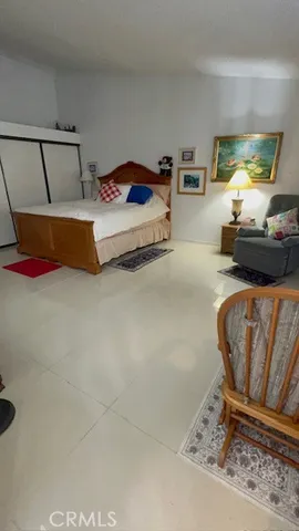 a bedroom with furniture and a couch