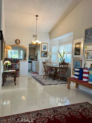 a view of a living room and dining room