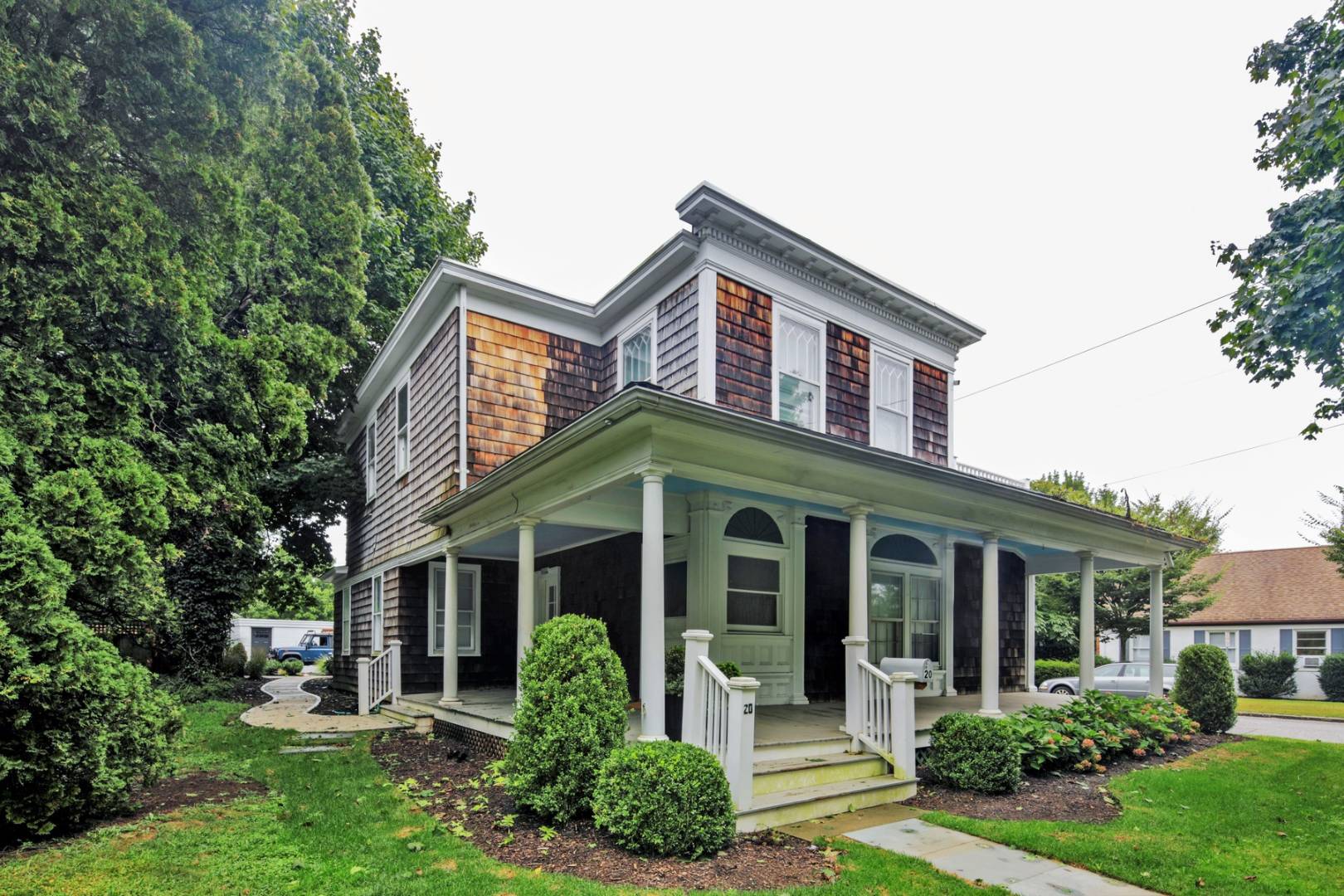 a front view of a house with garden