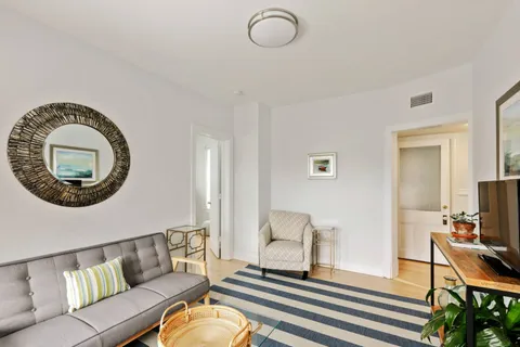 a kitchen with a stove a refrigerator and a sink