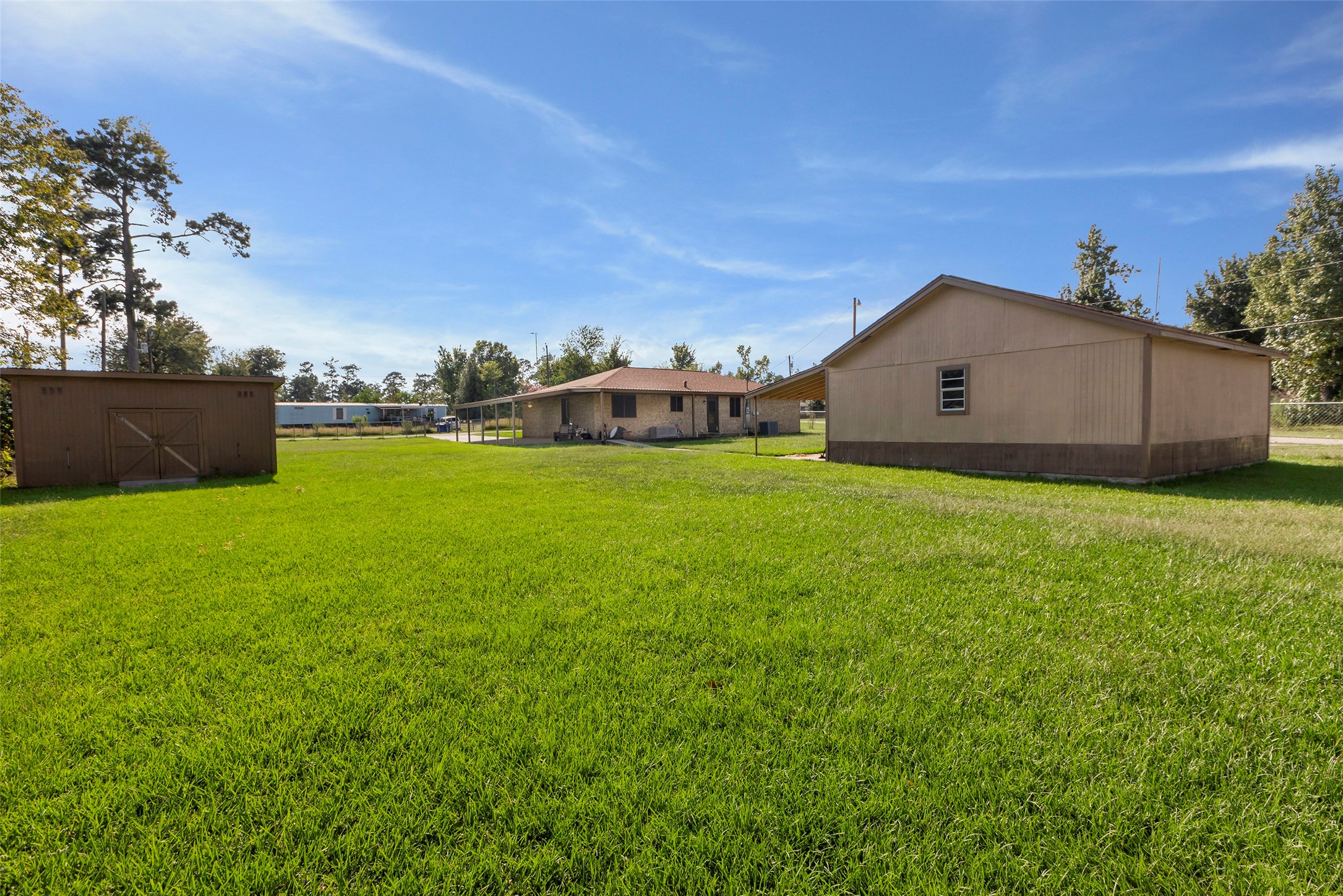 302 Walnut Cove Road Onalaska, TX 77360 - Photo 17 of 25 a view of a house with a yard