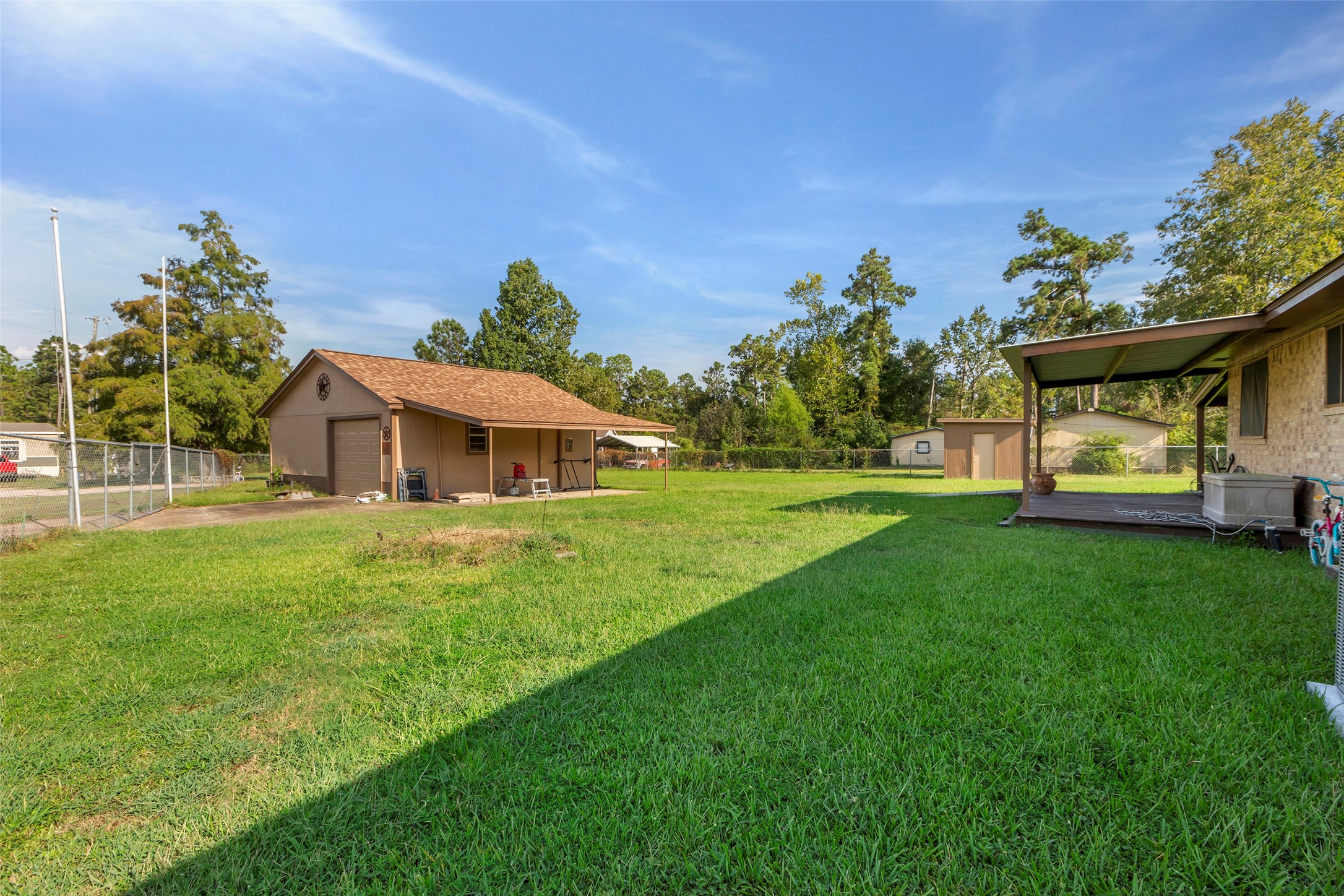 302 Walnut Cove Road Onalaska, TX 77360 - Photo 21 of 25 a front view of a house with garden