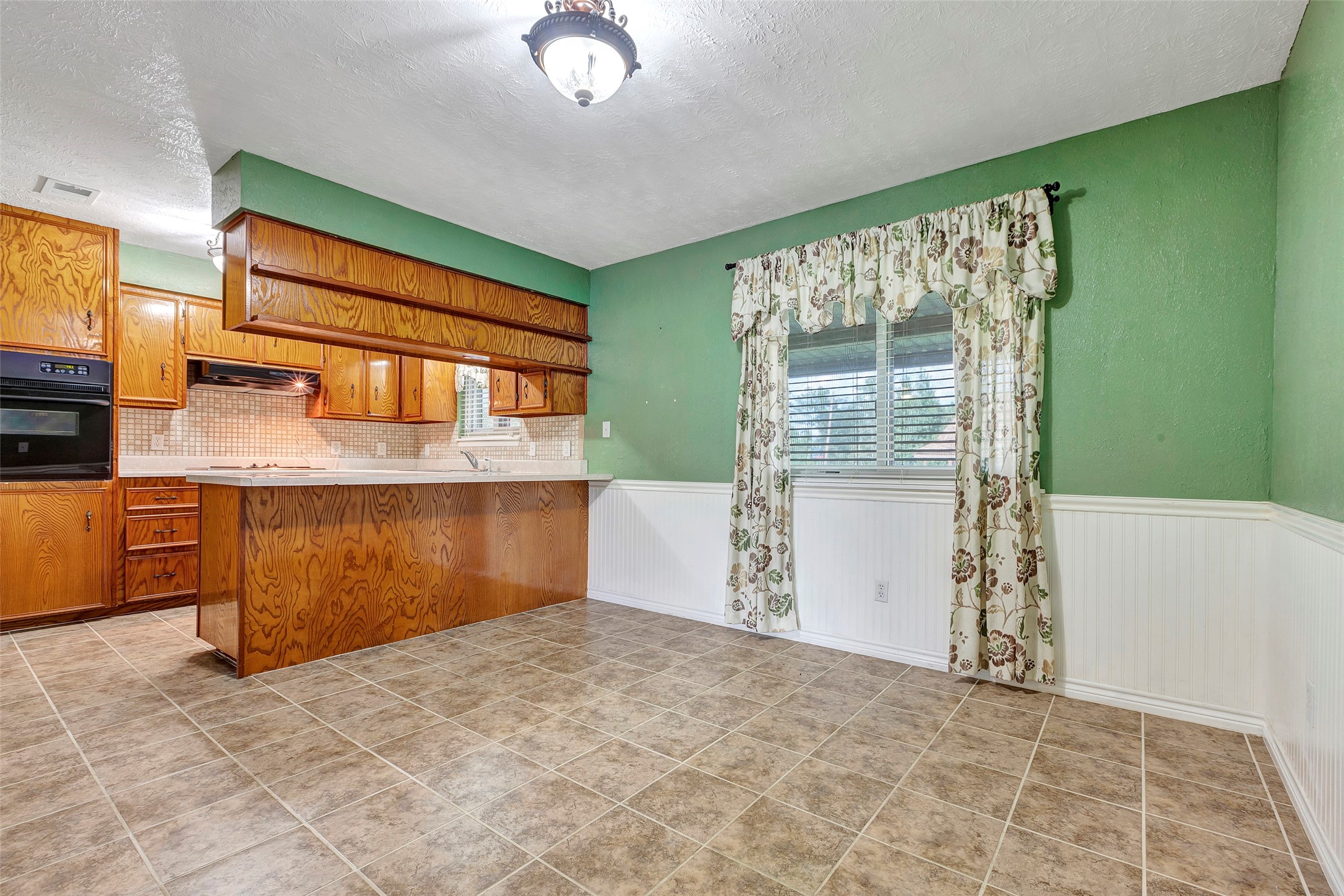 302 Walnut Cove Road Onalaska, TX 77360 - Photo 3 of 25 a view of a kitchen with a sink and cabinets