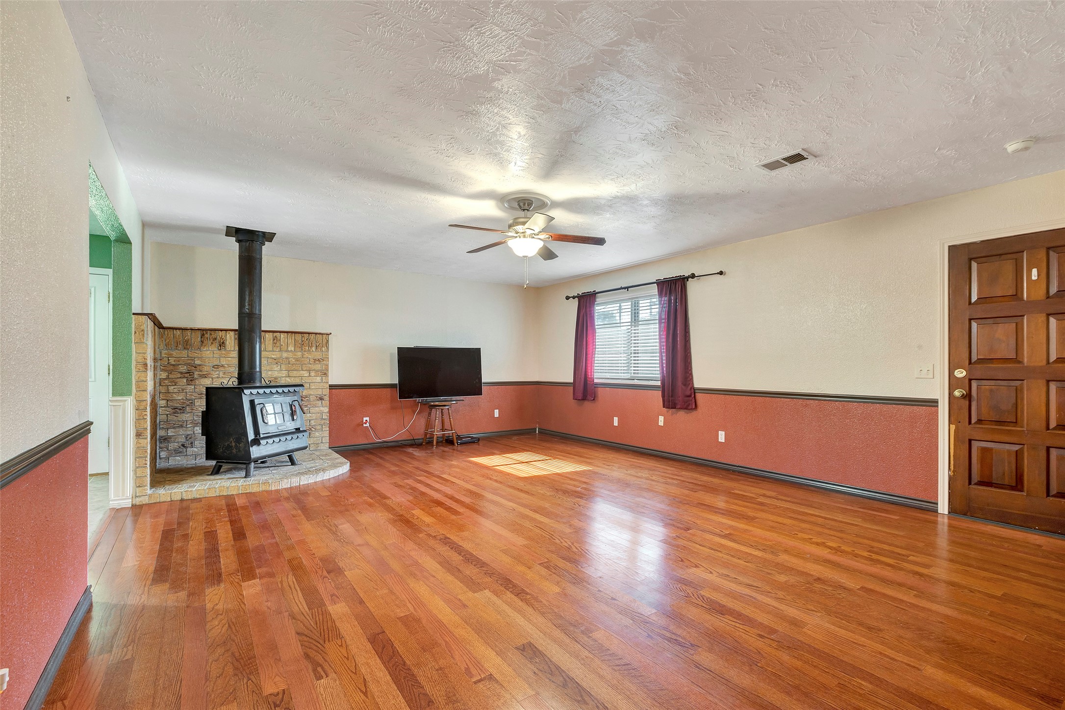 302 Walnut Cove Road Onalaska, TX 77360 - Photo 9 of 25 a living room with furniture and a wooden floor
