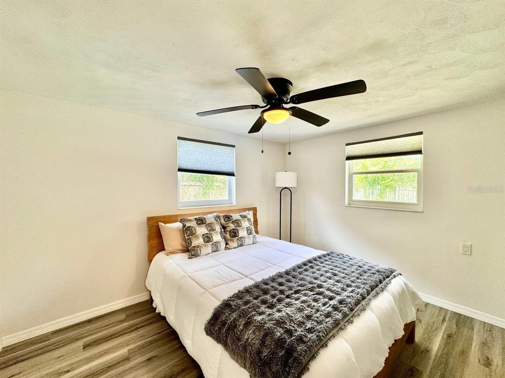 4282 Rudder Way New Port Richey, FL 34652 - Photo 17 of 34 a bedroom with a bed and a window