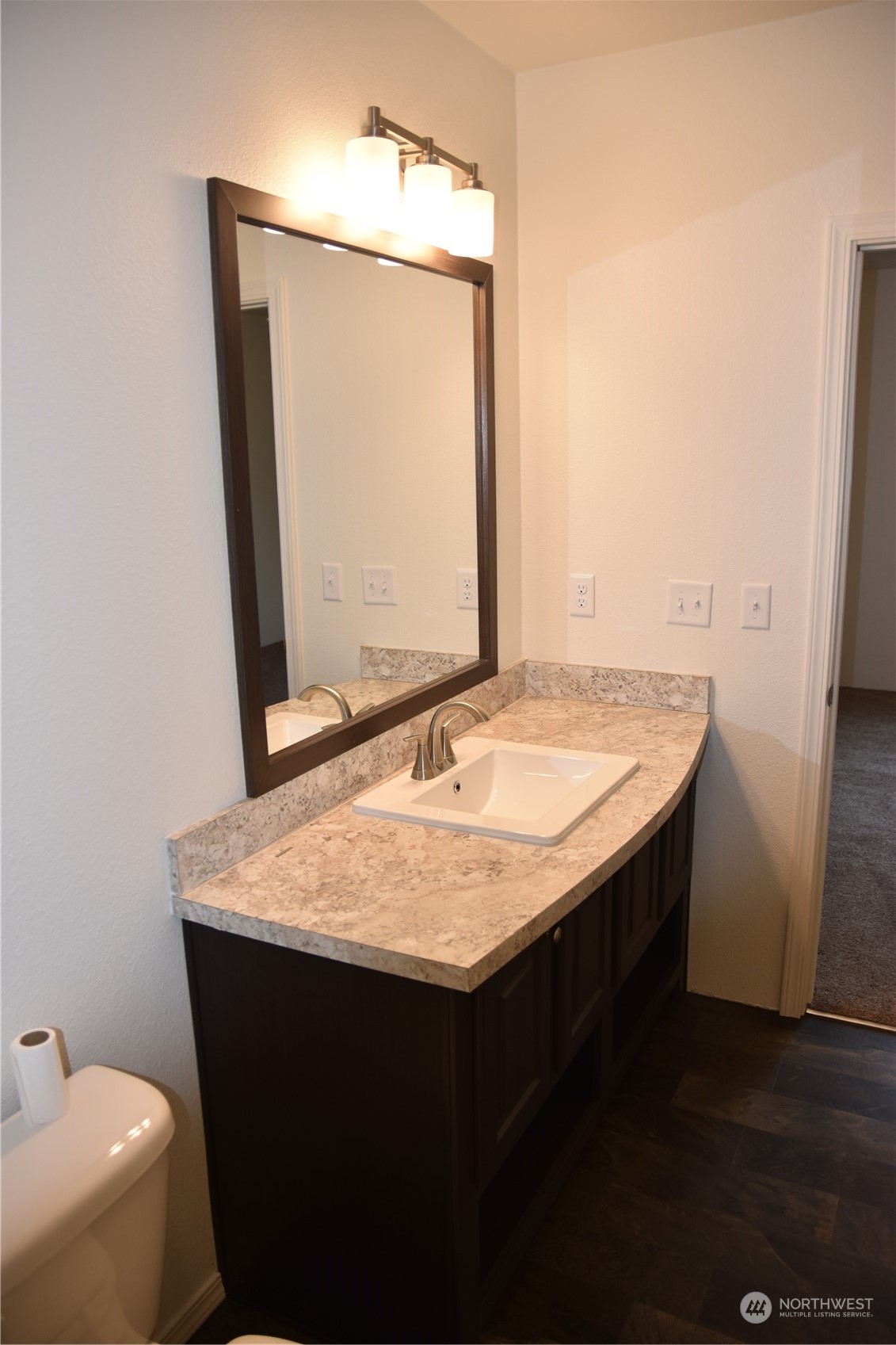 4322 Ocean Beach Highway Longview, WA 98632 - Photo 11 of 19 a bathroom with a granite countertop sink and a mirror