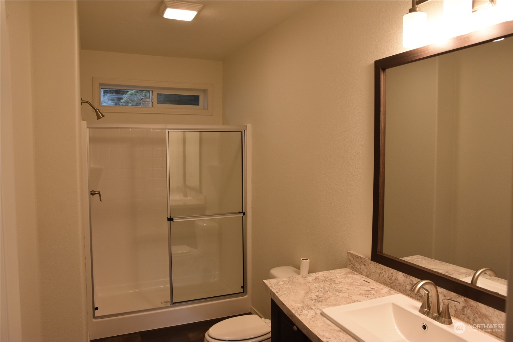 4322 Ocean Beach Highway Longview, WA 98632 - Photo 10 of 19 a bathroom with a sink a toilet and shower