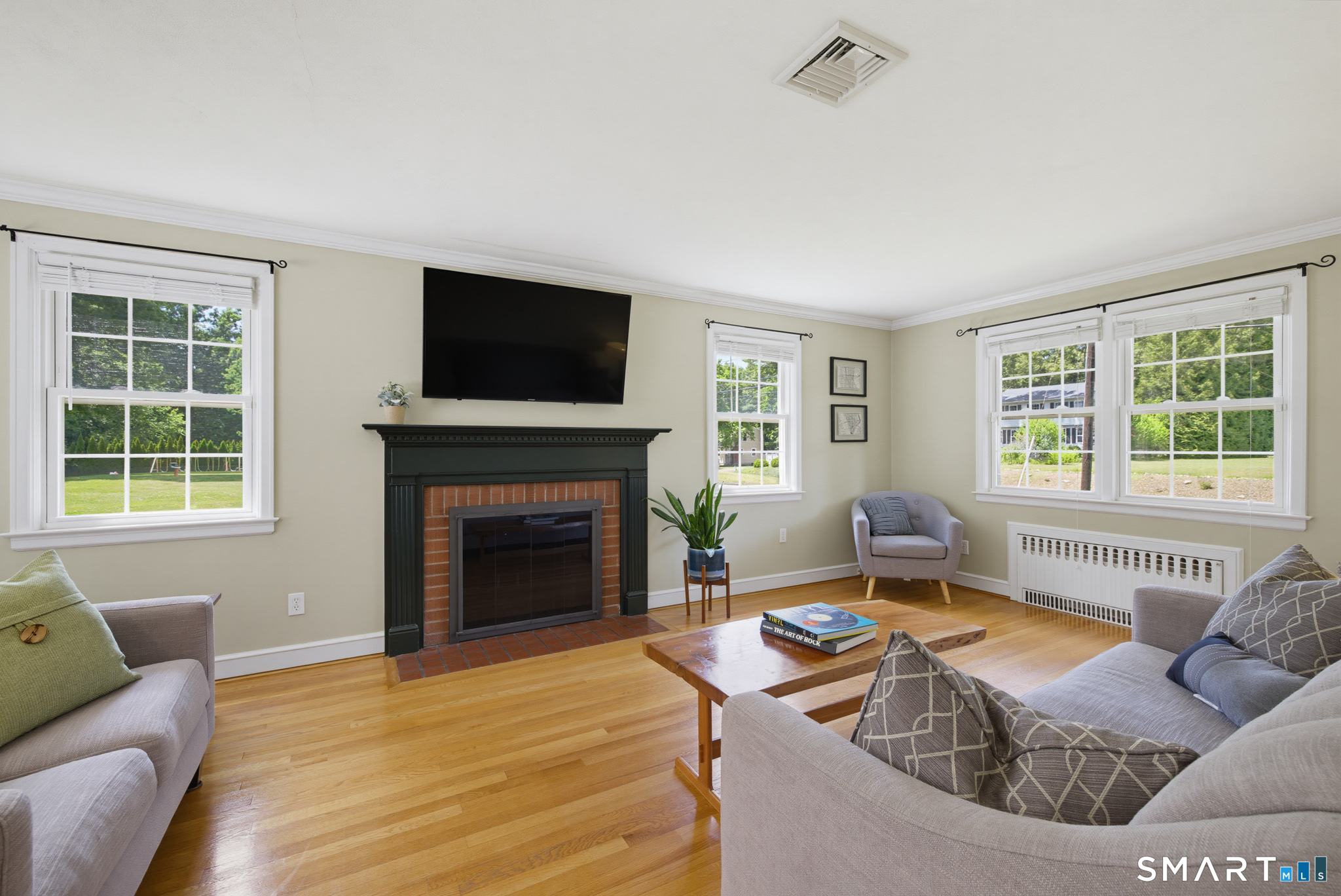 224 Spring Street Manchester, CT 06040 - Photo 4 of 39 a living room with furniture and a fireplace