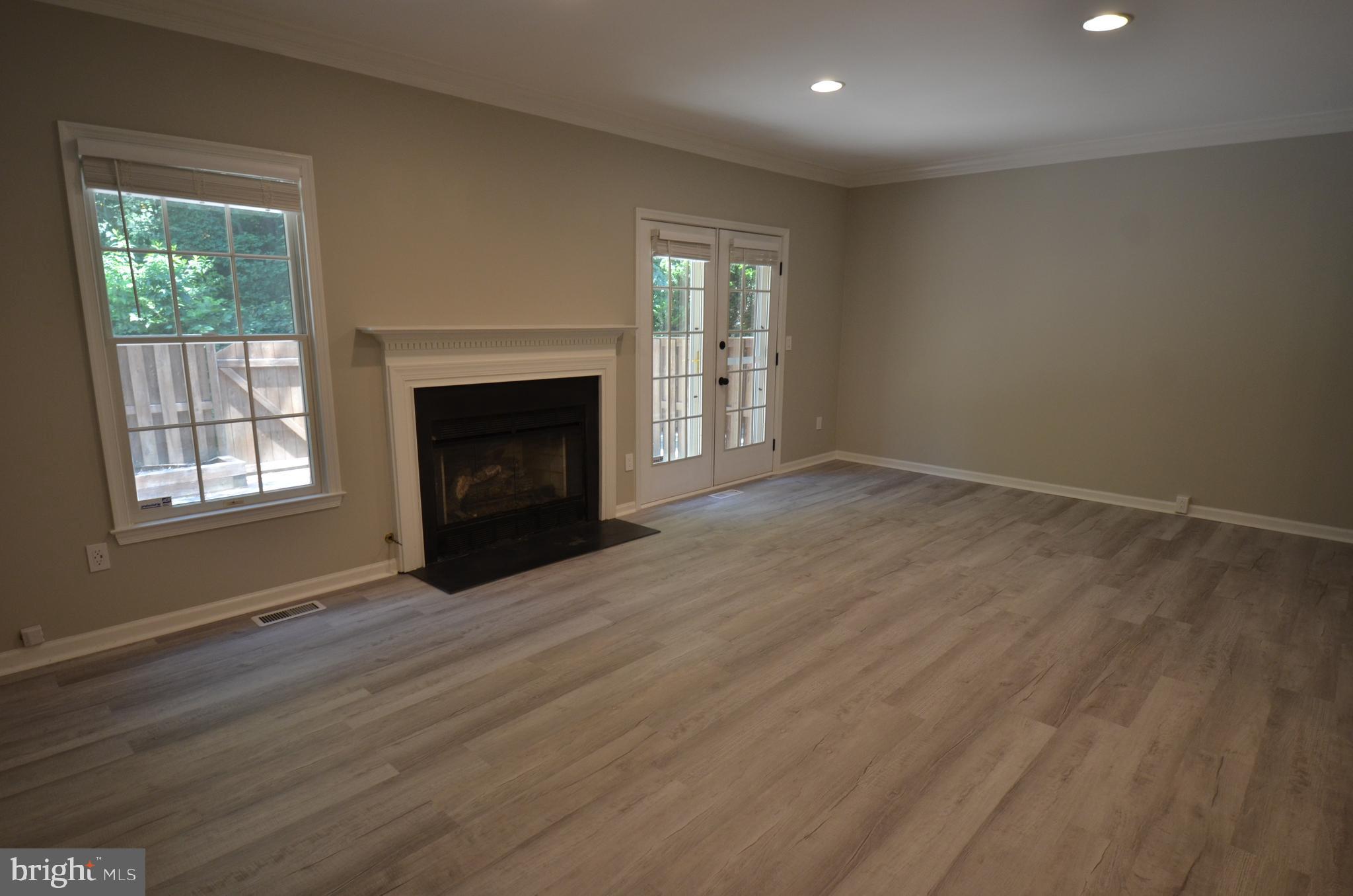 7559 Westmore Drive Springfield, VA 22150 - Photo 12 of 42 Living Room opens to private patio