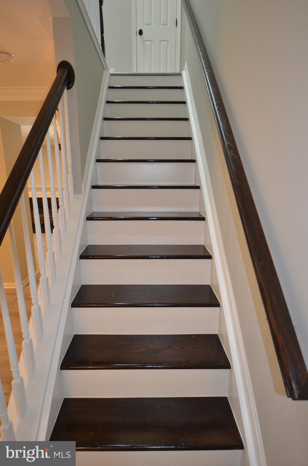 7559 Westmore Drive Springfield, VA 22150 - Photo 17 of 42 Espresso-finished stairs to upper level