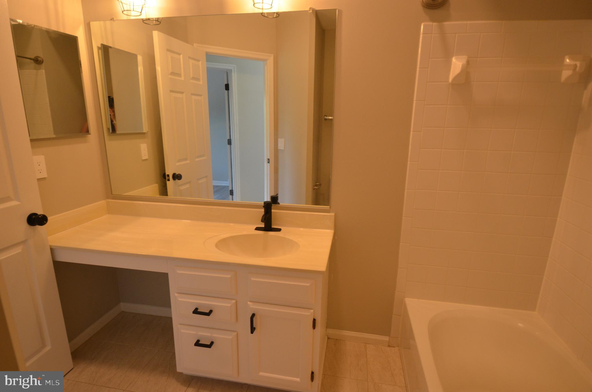 7559 Westmore Drive Springfield, VA 22150 - Photo 31 of 42 Bathroom Two opposite Bedrooms 2 & 3