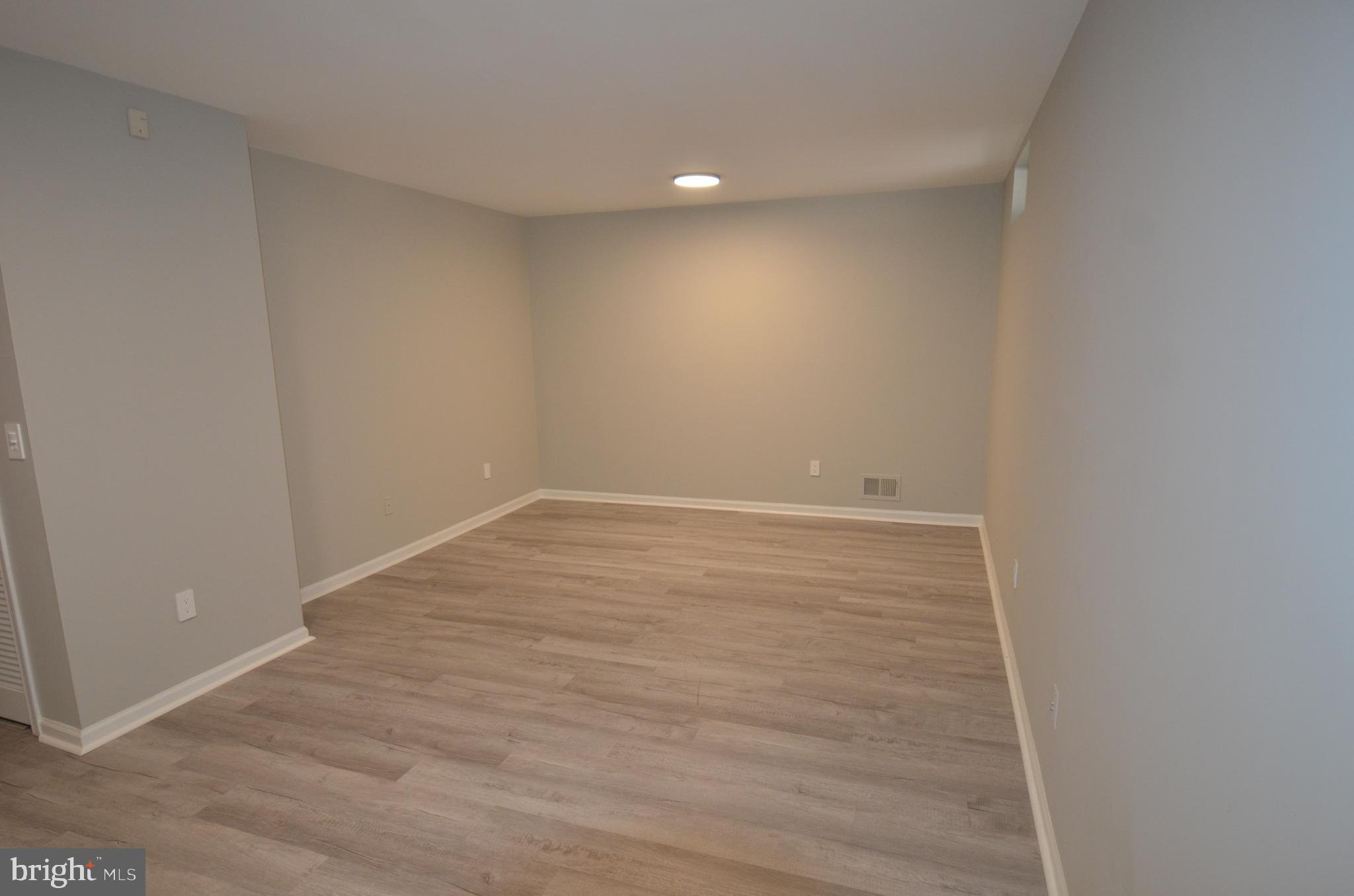 7559 Westmore Drive Springfield, VA 22150 - Photo 36 of 42 Lower-Level Great Room: fitness or entertainment