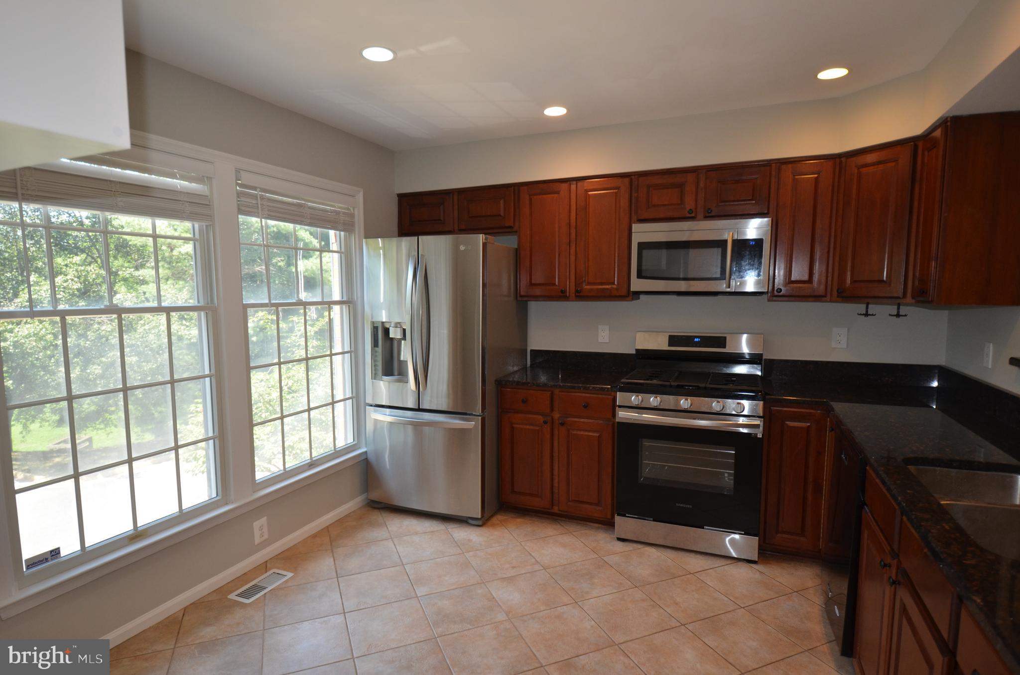 7559 Westmore Drive Springfield, VA 22150 - Photo 6 of 42 Sunlight-filled kitchen with ceramic tile