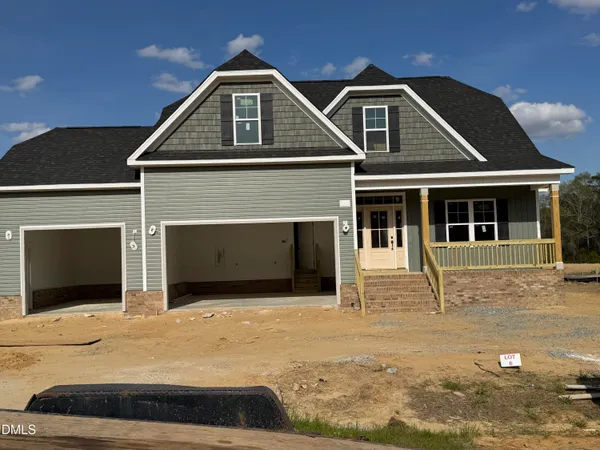 a front view of a house with yard
