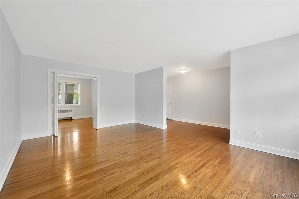 504 Pelham Road New Rochelle, NY 10805 - Photo 8 of 26 a view of empty room with wooden floor